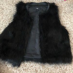 Black faux fur vest.